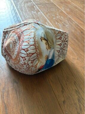 Religious-Themed Decorative Face Mask with Artistic Print